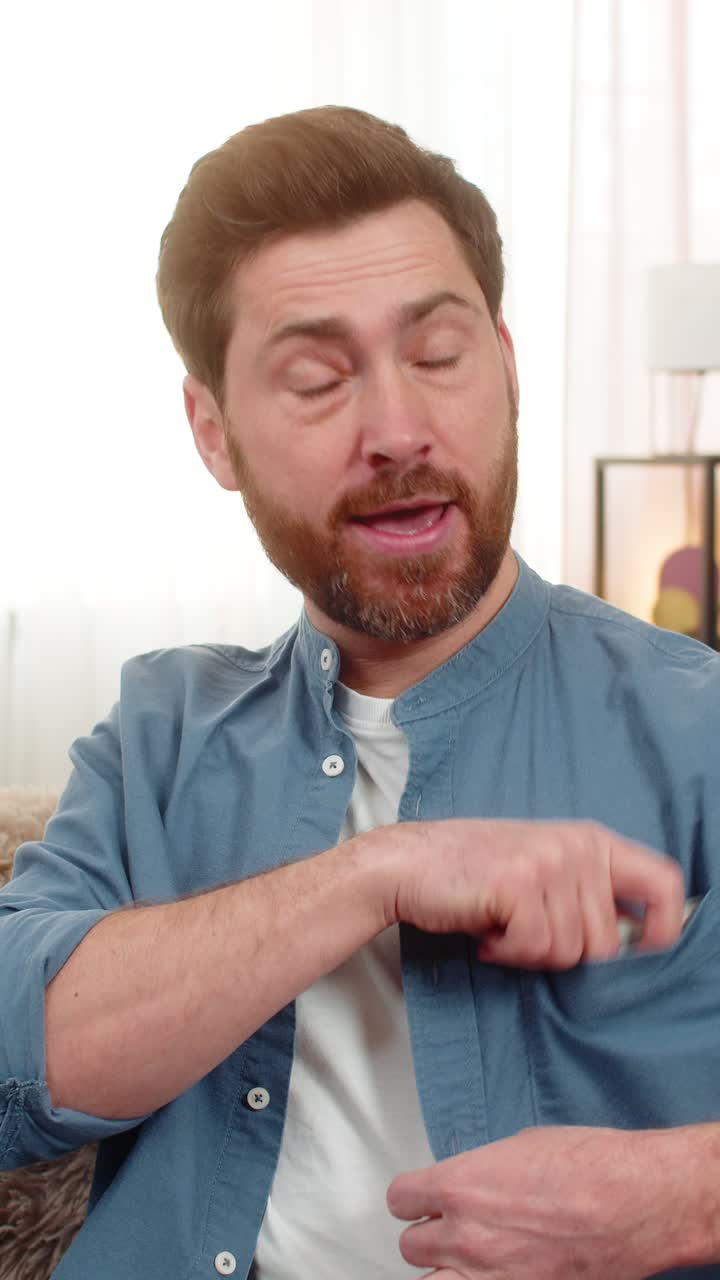 Man holding stack of dollar cash banknotes counting money smiling feeling happy about big earnings