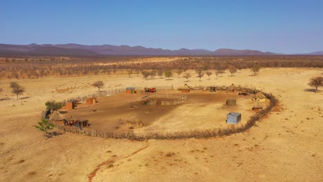 Beautiful-vista-aérea-over-a-round-Himba-African-tribal-settlement-and-family-compound-in-northern-Namibia-Africa-1