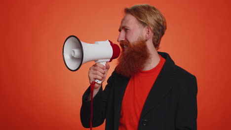 smiling bearded man talking with megaphone, proclaiming news, loudly announcing sale advertisement