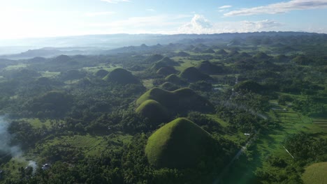 drone shot of the chocolate hills in bohol at sunrise