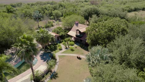 idyllic suburbs with house and swimming pool, aerial captured during sunshine day, location santiago, nuevo leon, mexico