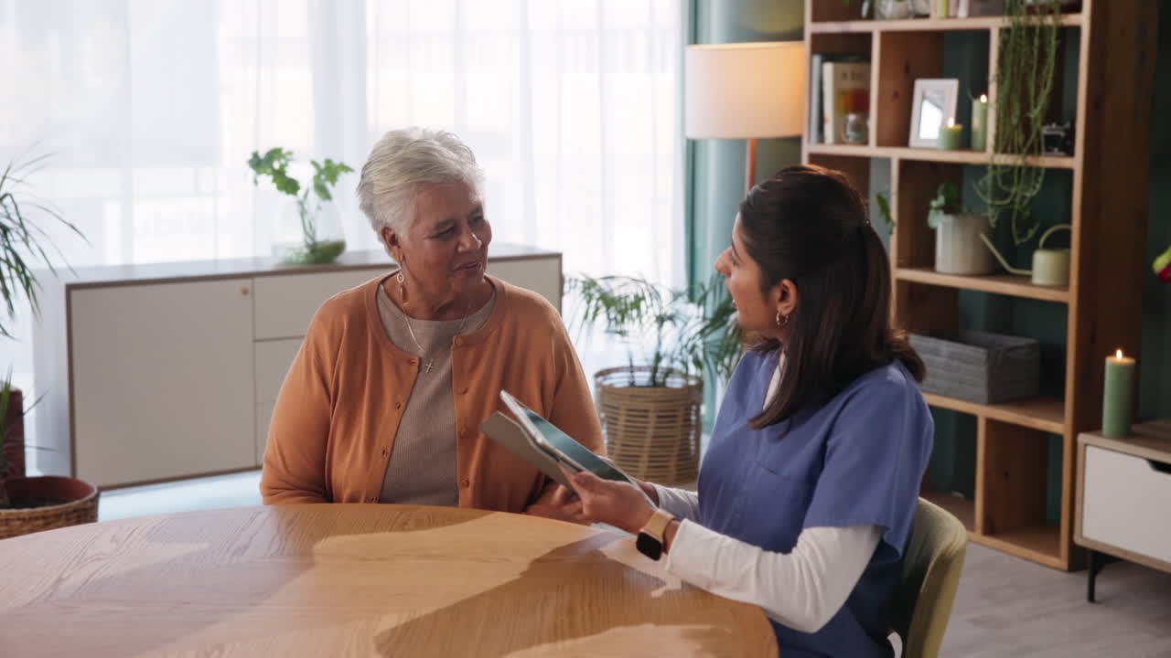 Senior woman talking with home caregiver