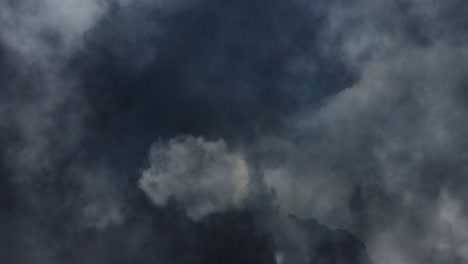 a flash of lightning as a thunderstorm in the dark cumulonimbus clouds