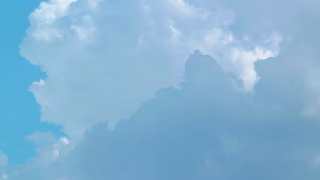 time lapse of beautiful white fast moving clouds and sky in sunny day, medium shot