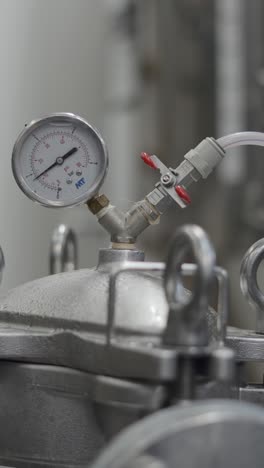 close-up of an industrial pressure gauge on equipment