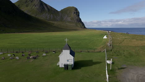 a very small and special church at a beautiful spot at unstad beach, lofoten, norway