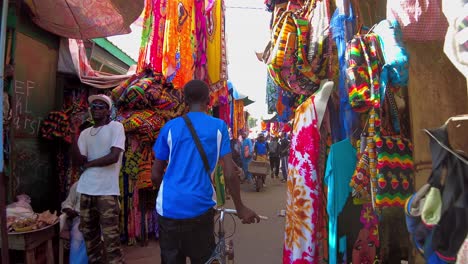 vibrant african market: colorful clothing and busy streets