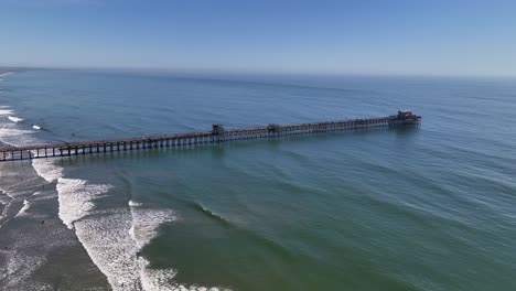 panning right aerial view of the oceanside ca pier