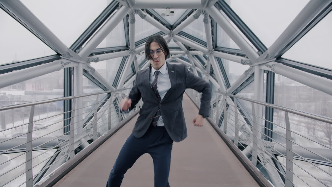 Businessman Dancing on a Modern City Bridge