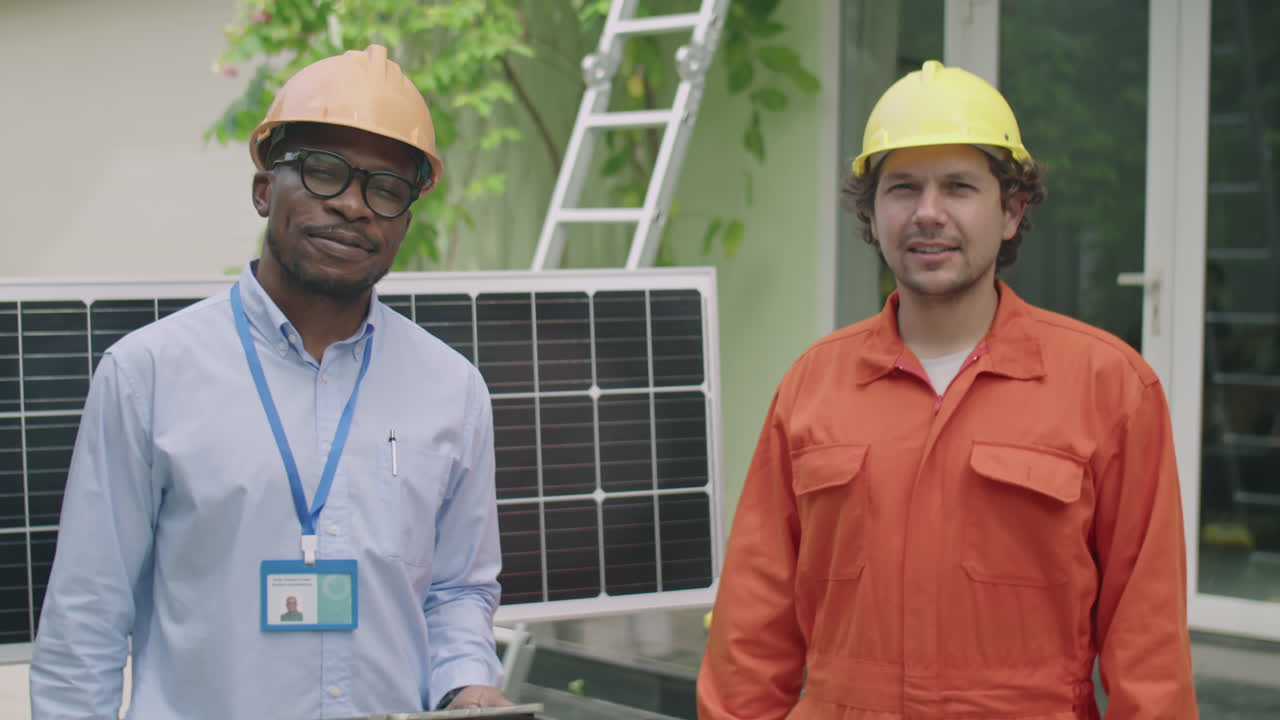 Portrait of Diverse Engineer and Worker by Solar Panel Outdoors