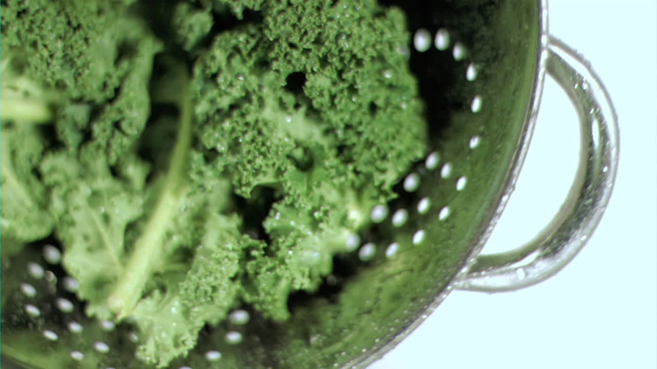 Broccoli in sieve in super slow motion