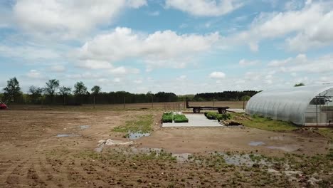 Panning-Drone-shot-of-an-agricultural-greenhouse-in-Michigan