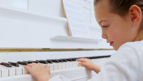 Adorable-girl-playing-piano-4k