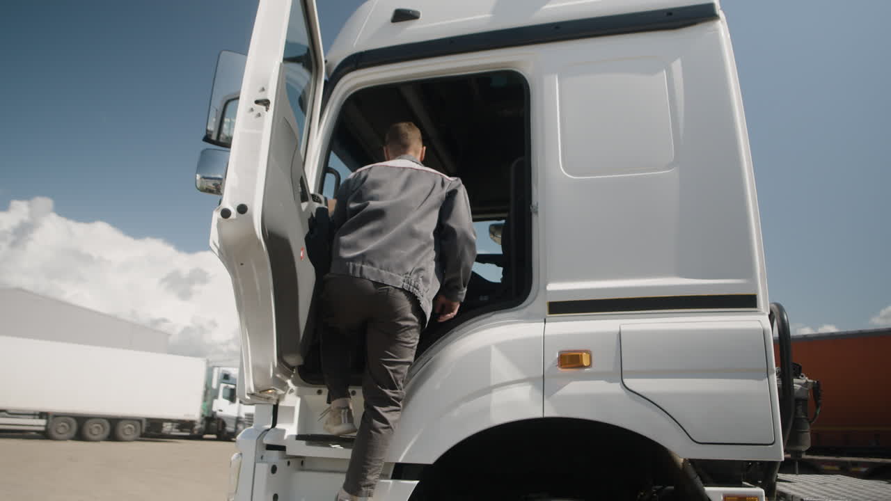 Man entering a white truck