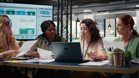 vertical video empowered businesswomen evaluating graphs and strategy reports