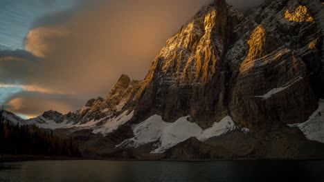 sunrise time lapse, floe lake and snow capped hills of kootenay national park, british columbia, canada