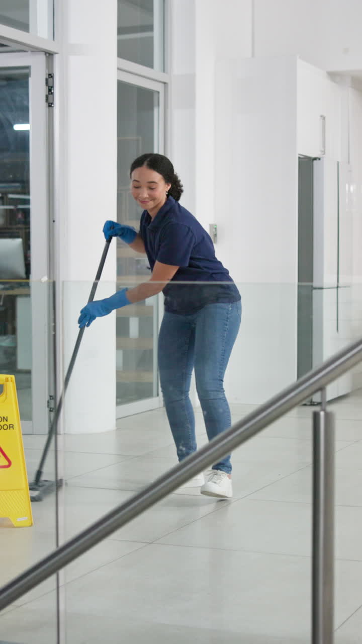 A woman mopping a floor