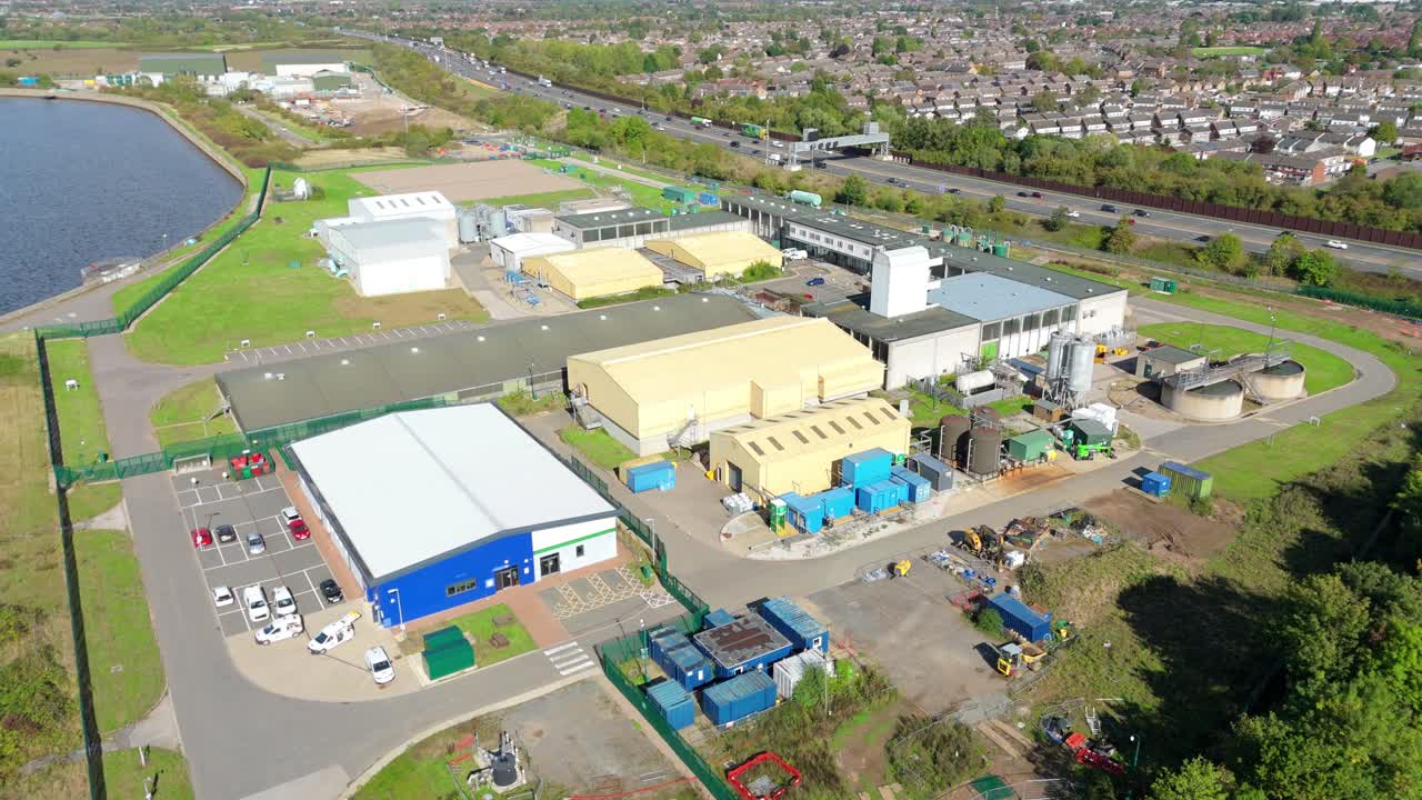 Overhead cinematic drone pass revealing clarifiers digesters and filter fields at Severn Trent Long Eaton facility
