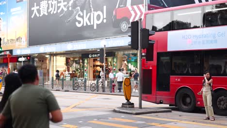 traffic and pedestrians at a bustling intersection