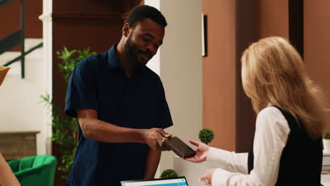 Front-desk-staff-reviewing-id-papers