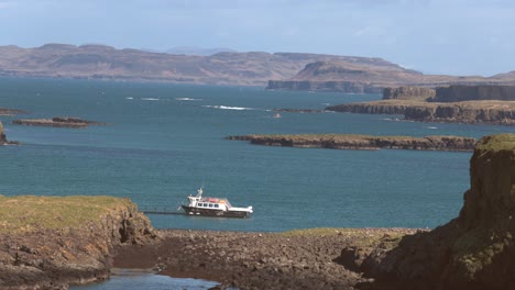 Hand-held-shot-of-a-small-cruise-boat-docked-allowing-tourists-onto-Lunga-Island