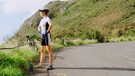 middle age woman stretching on country road 4k