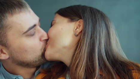 couple kissing and laughing