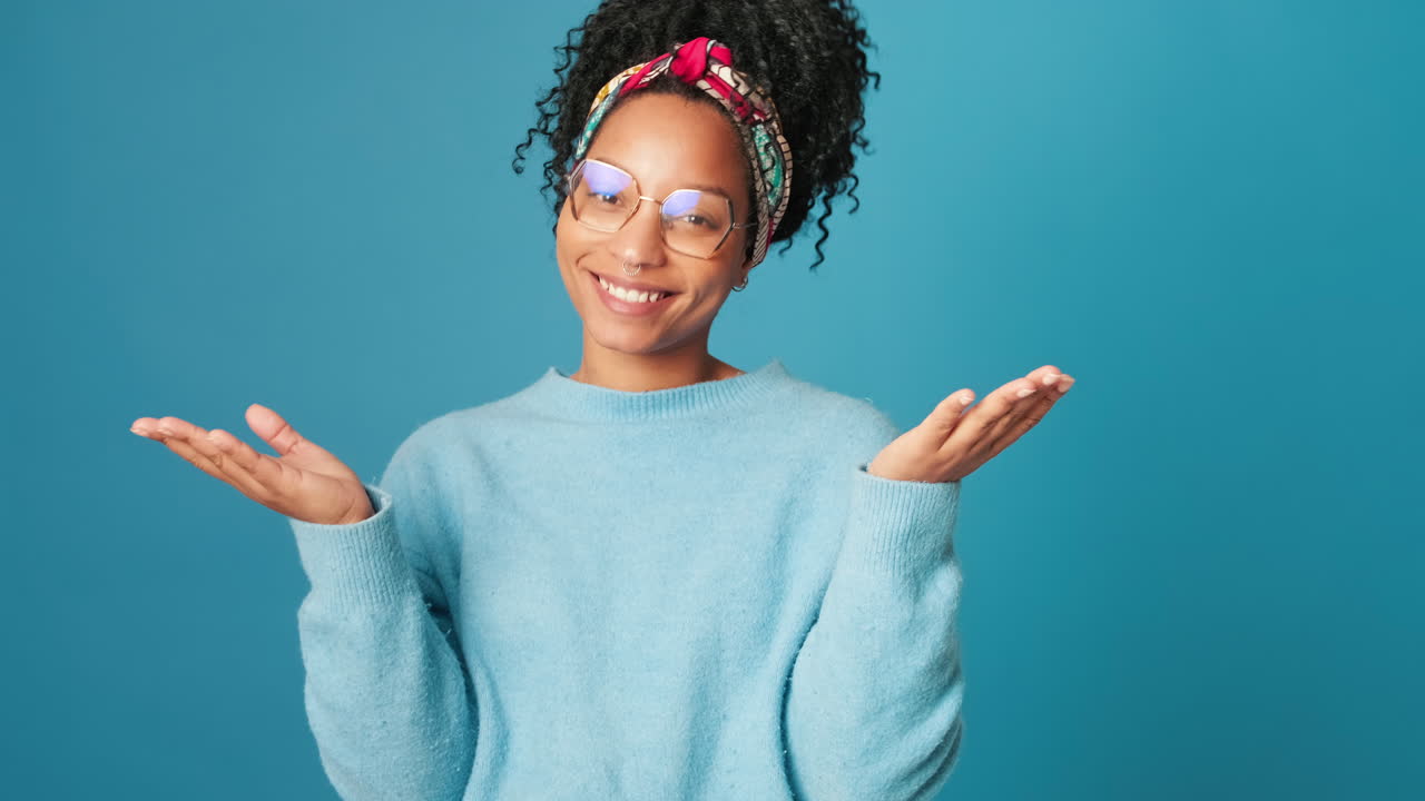 Cheerful Young Woman Blowing Kisses and Smiling Playfully