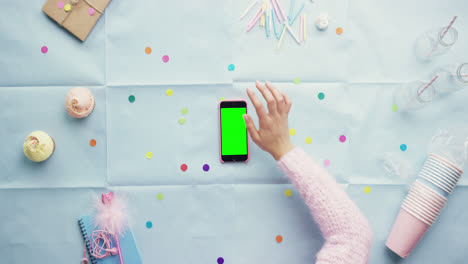 Top-view-woman-using-mobile-phone-gestures-Birthday-Party-planning-hands-from-above---Red-Epic-Dragon