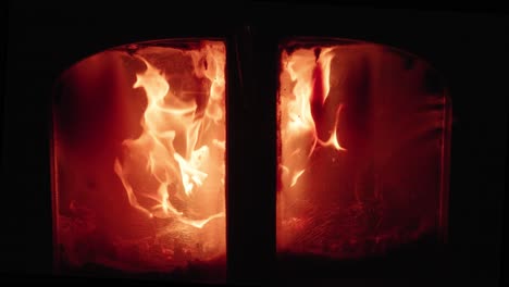 an old woodstove with pretty flames from dry wood - slow motion