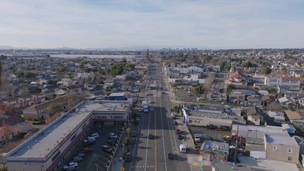 Aerial drone footage flying up the main boulevard in south Oakland heading in the direction of downtown.