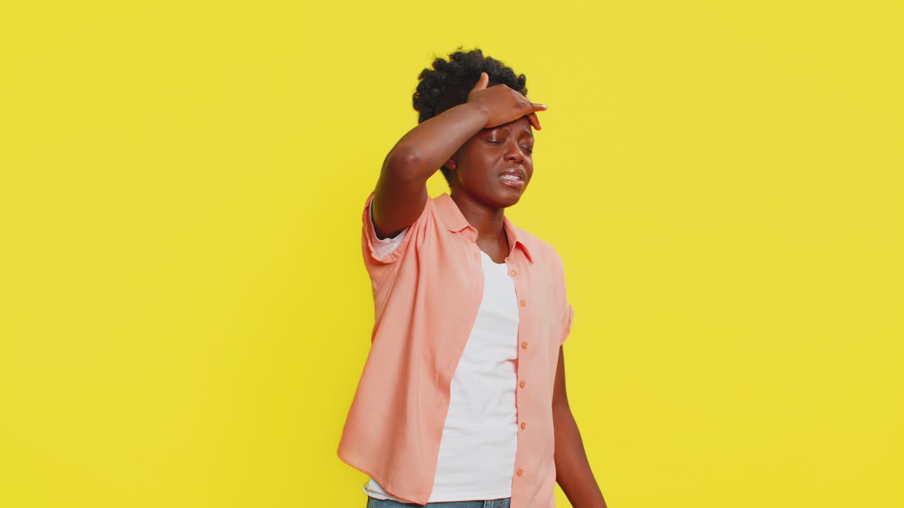 Black woman holding head unsteady posture dizzy expression struggling with balance weakness