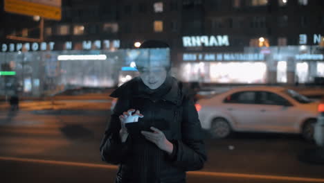 Woman-at-the-bus-stop-passing-time-with-tablet-computer