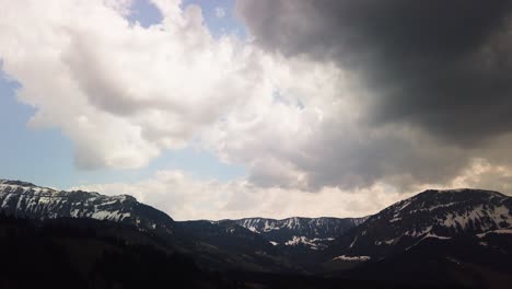 smooth moving timelapse of fast moving clouds with mountain scenery in switzerland, motionlapse of upcoming thunderstorm