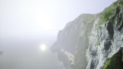 scenic coastal cliffs at sunrise casting reflections on calm waters