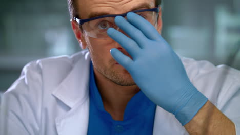 laboratory worker face. medical researcher working in lab. young scientist