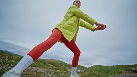 fit girl exercising nature exuding energy and freedom. motivated athlete squats