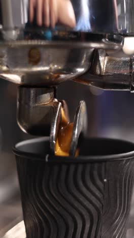 espresso machine pouring coffee into a cup