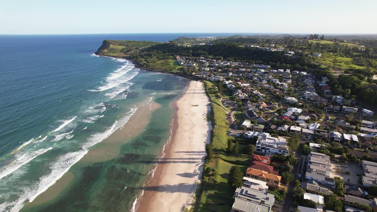 Beachfront Homes With View Of Pat Morton Lookout In Distance. Seven Mile Beach In Lennox Head, NSW, Australia. aerial pullback shot