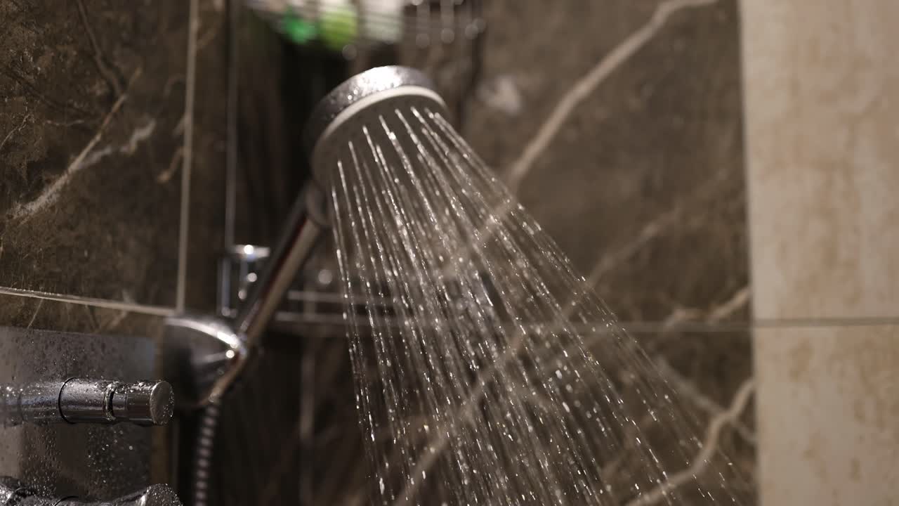 Close-up of a shower head spraying water