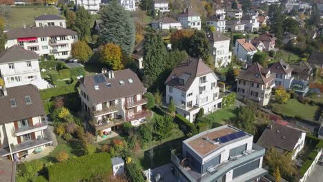 drone aerial view: neighbourhood in lausanne town: individual houses, villas in the capital city ,vaud, switzerland