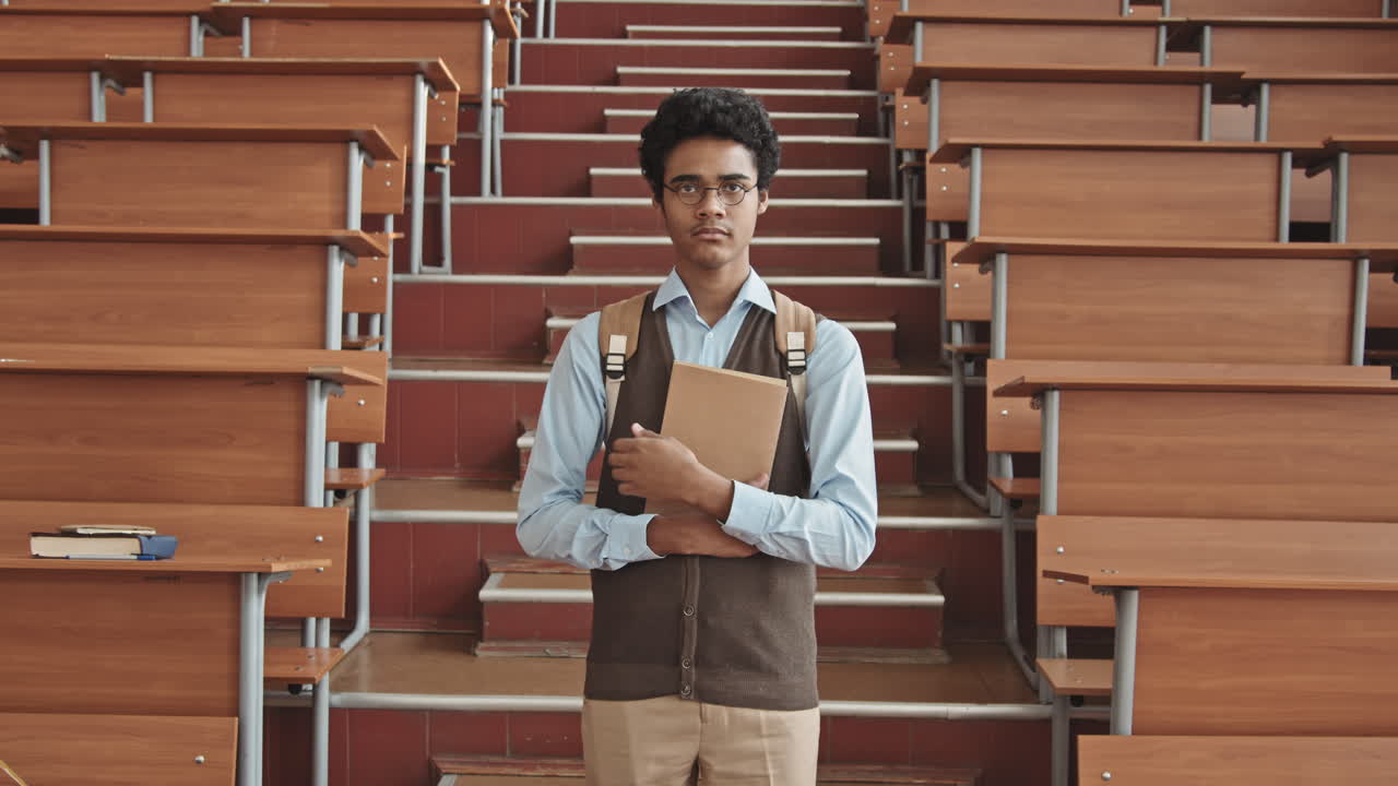 Insecure Mixed-Race Student in Eyeglasses Standing in Lecture Hall