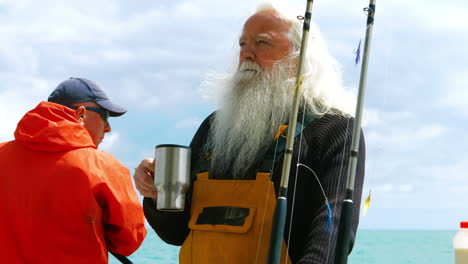 fisherman drinking cup of coffee