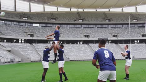 male rugby players playing rugby match in stadium 4k