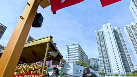 exploring a temple amidst hong kong skyscrapers