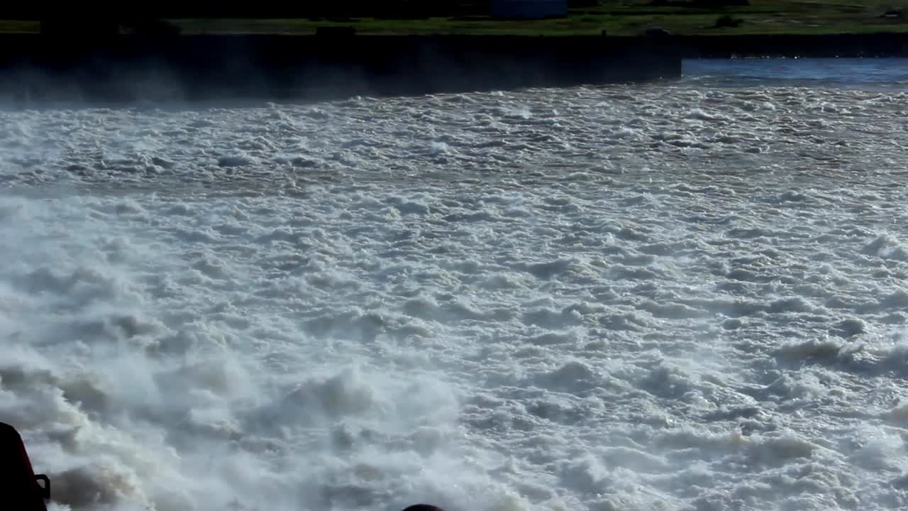 Powerful White Water Rushing from a Dam Spillway