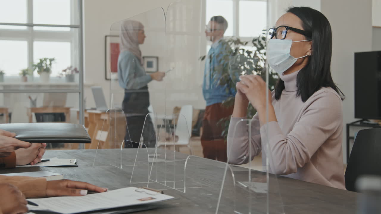 Woman in Face Mask Singing Contract at Job Interview