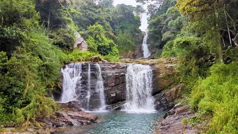 scenic slow motion view of kadiyanlena falls cascading tiered waterfall on mahaweli river in kandy district of sri lanka