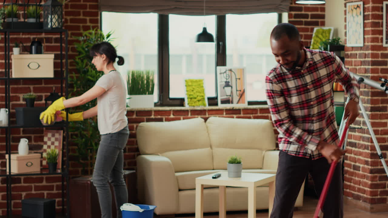Mixed race people cleaning household with tools and equipment