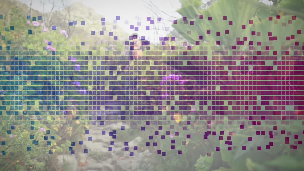 Man hiking mountain trail, animated mosaic grid floating over landscape, showing technology data
